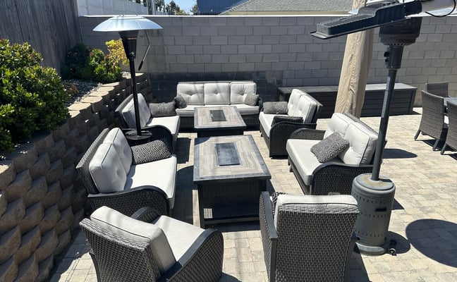 Patio with wicker furniture, fire table, and patio heaters at the Arroyo Grande vacation home